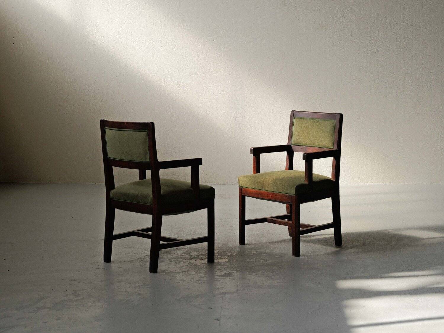 Pair of modernist armchairs in solid oak, France, circa 1940.