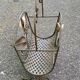 Vintage wrought iron magazine rack with flower pattern.