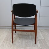 Vintage armchair in teak and black leather model Casina 60s