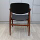Vintage armchair in teak and black leather model Casina 60s