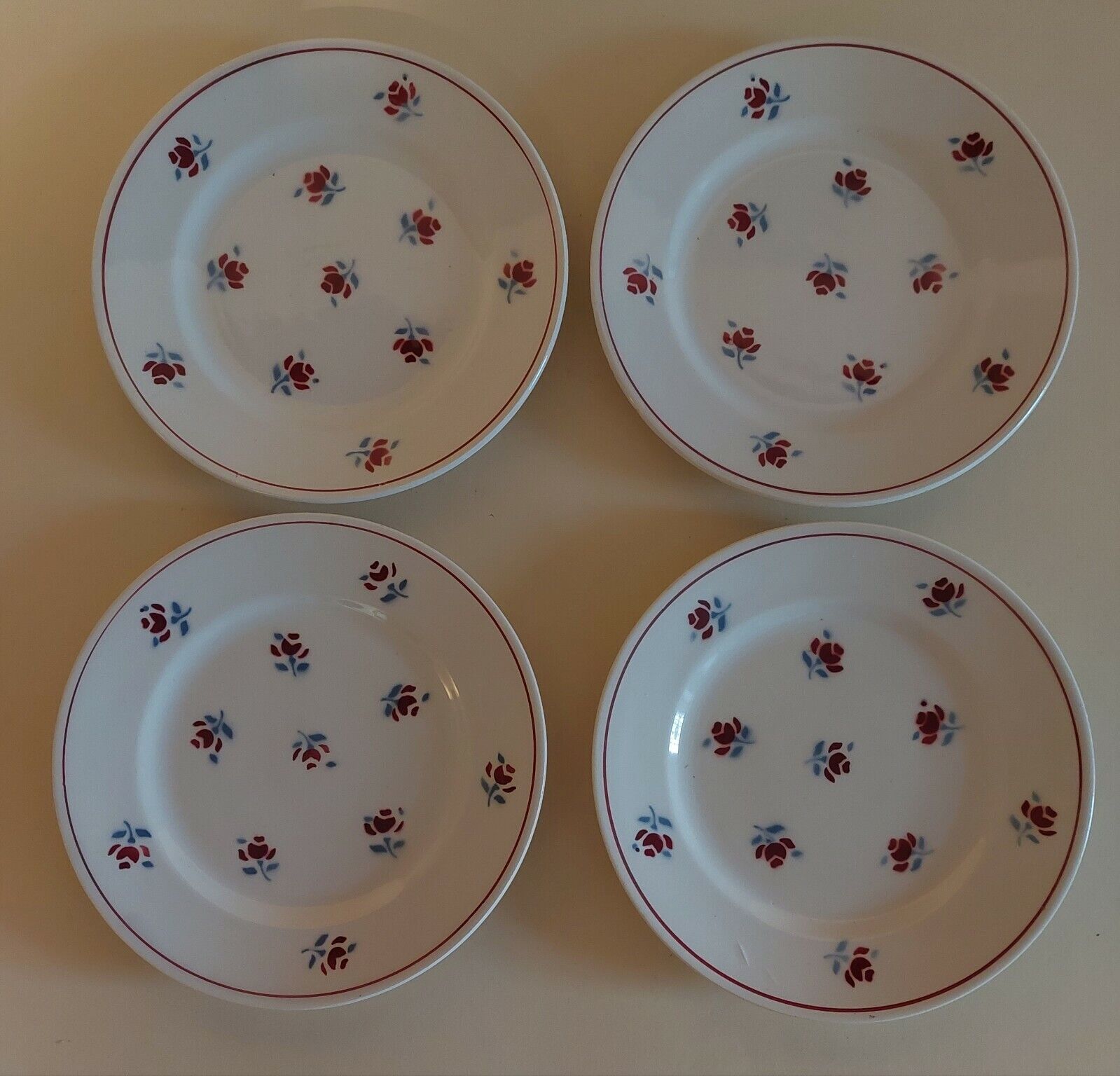 Series of four dessert plates in earthenware Saint Amand décor Rosettes