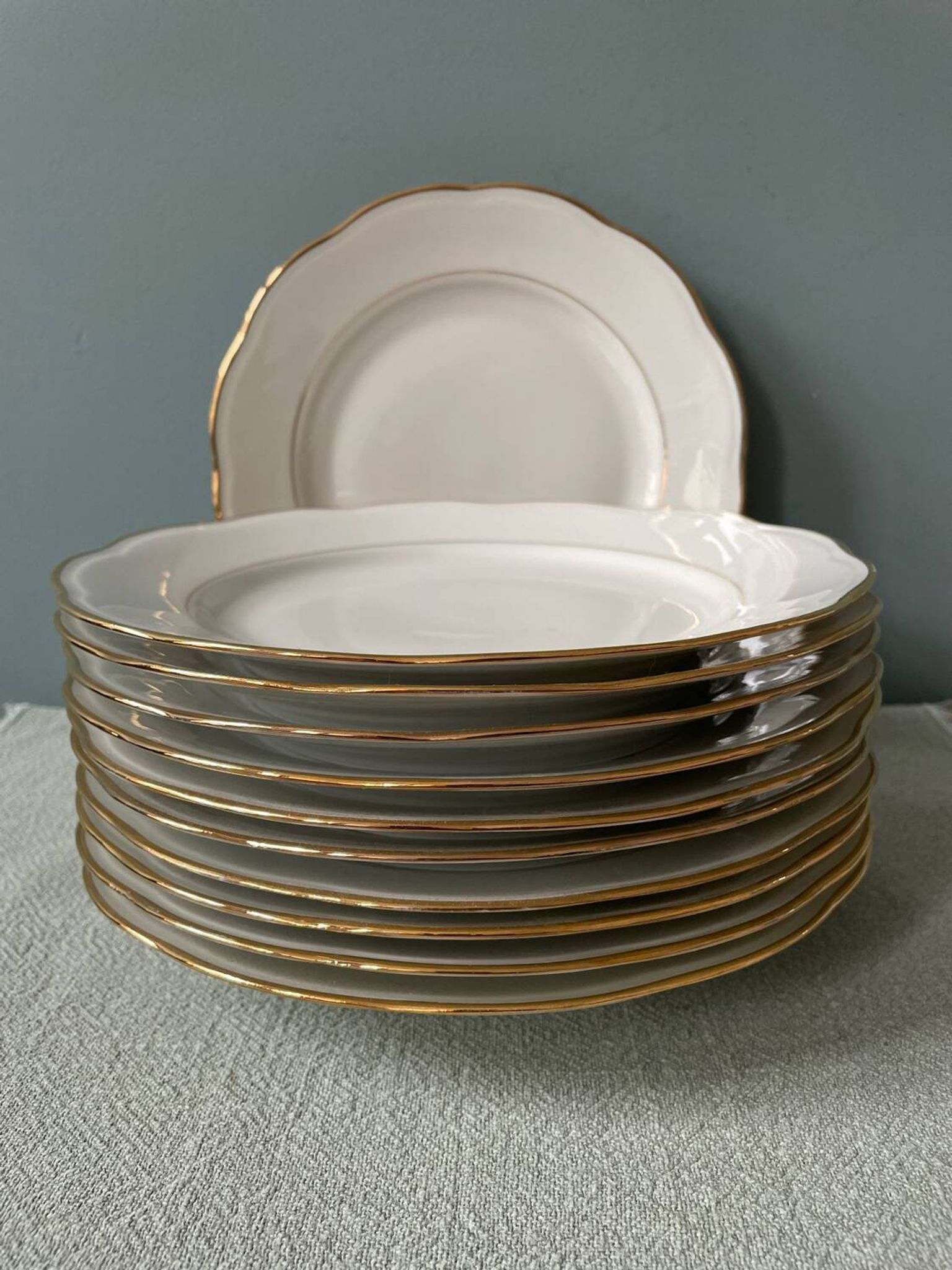 Series of 11 old flat plates in white porcelain and gold edging