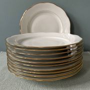 Series of 11 old flat plates in white porcelain and gold edging