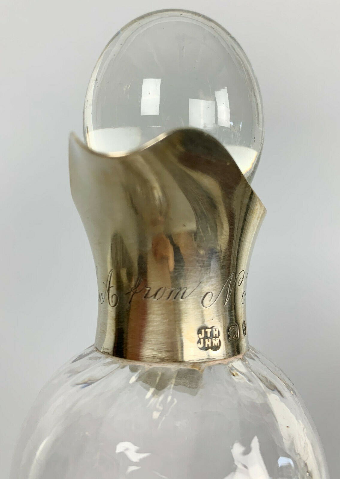 Blown glass carafe with silver frame