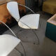 Set of two design chairs in steel and faux leather.