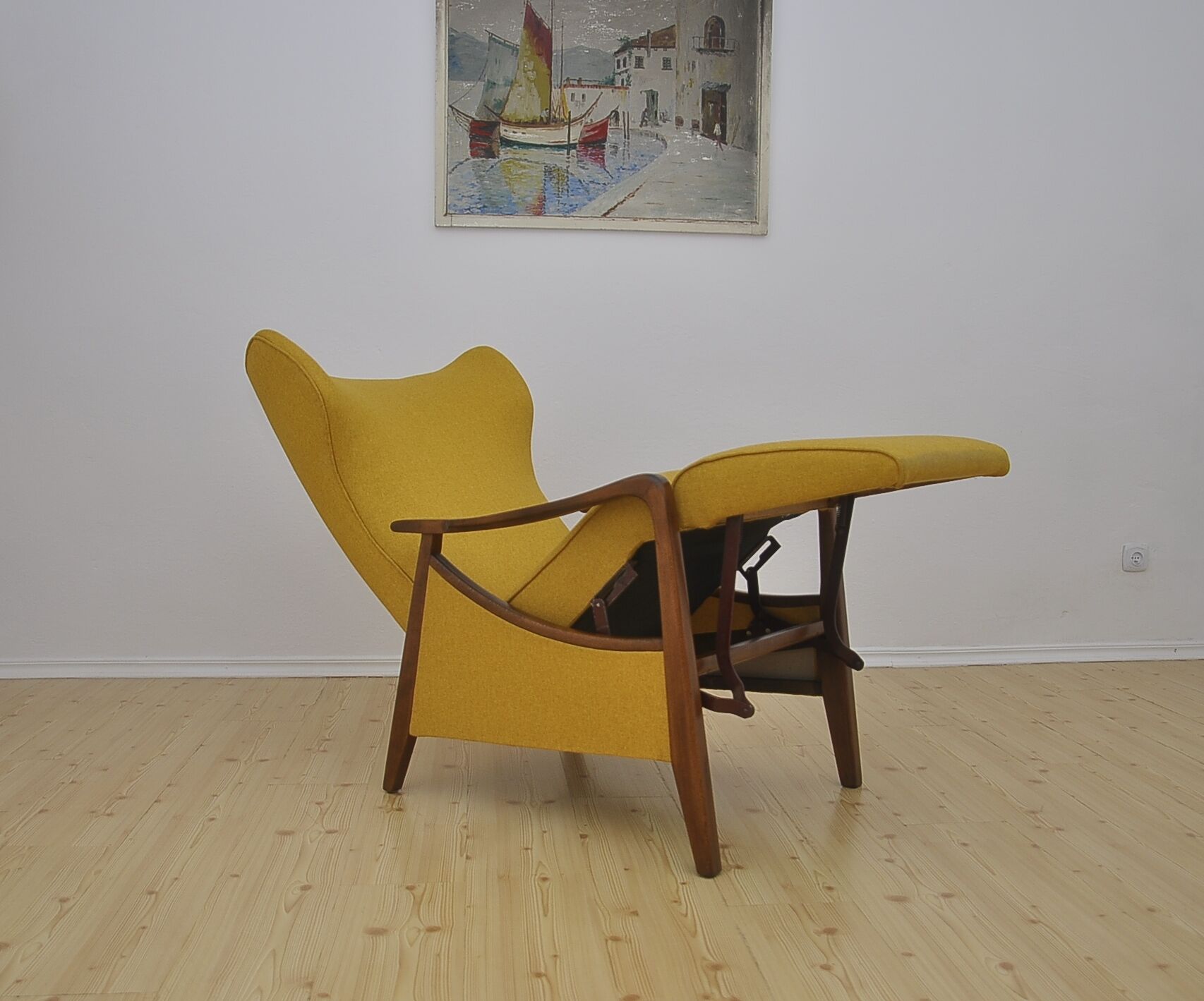 Mid-century Wingback armchair with folding footrest, 1960s