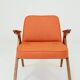 Fauteuil lounge vintage en laine, tissu orange et bois de hêtre