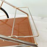 Rolling trolley in gold metal