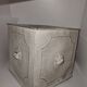 Square planter with a patinated iron lion's head