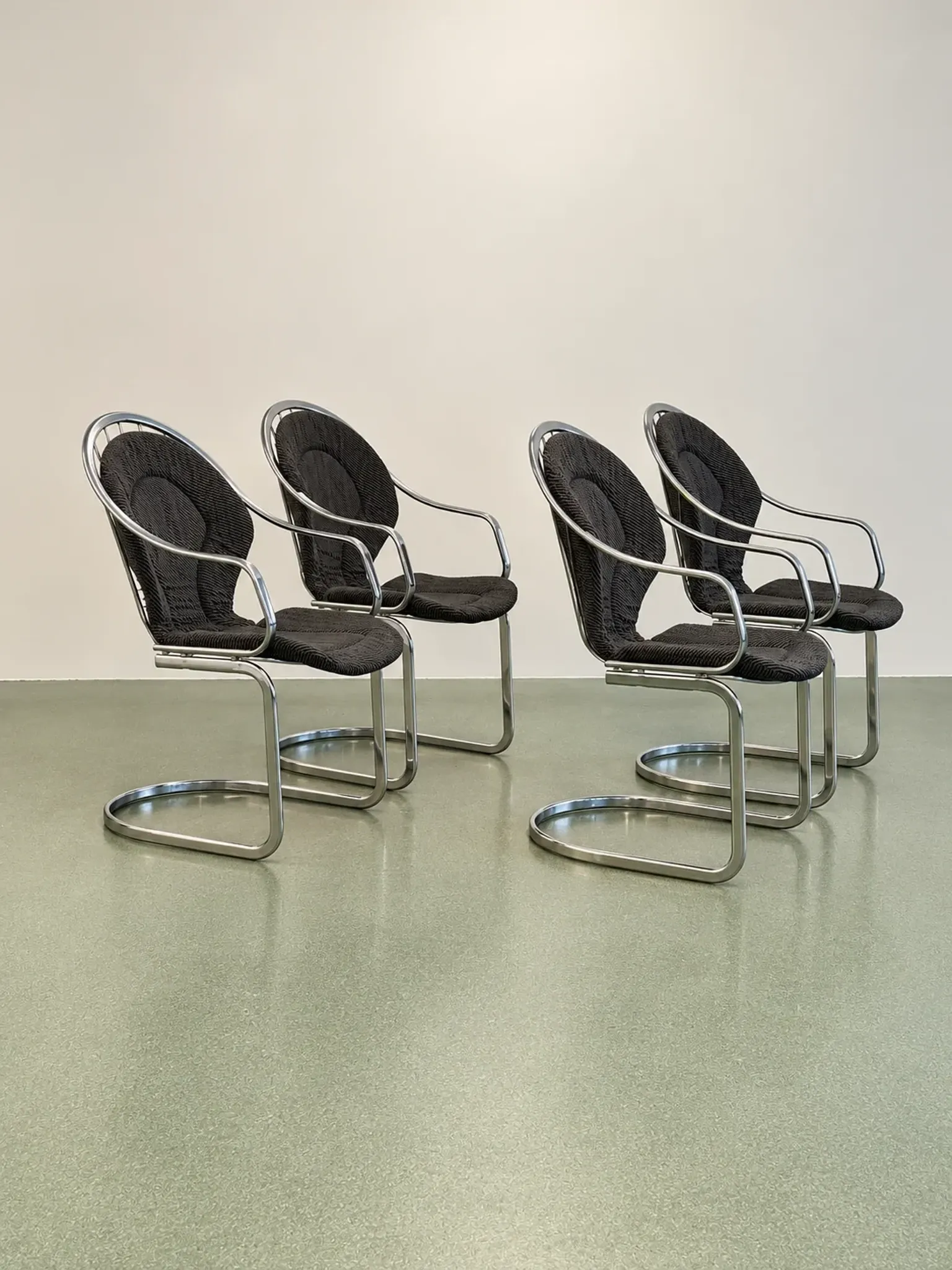 Set of four chrome cantilever dining chairs, 1970s