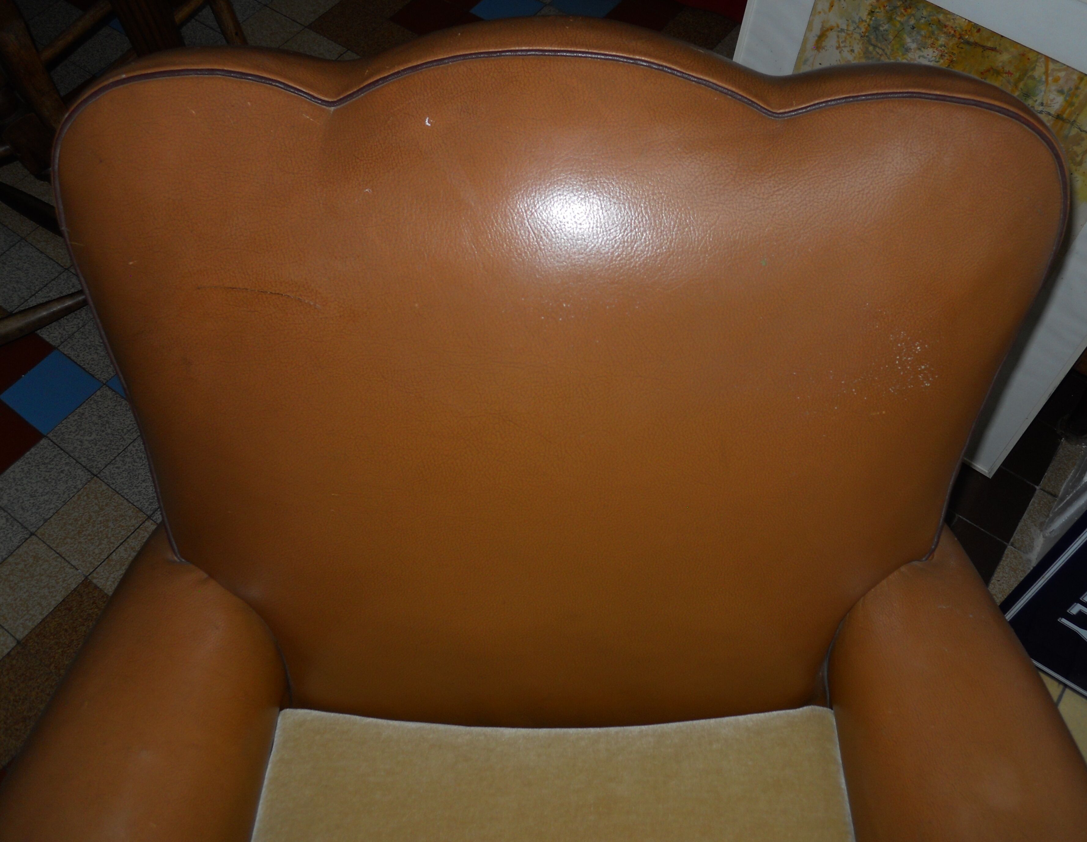 Brown leather club armchair