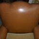 Brown leather club armchair