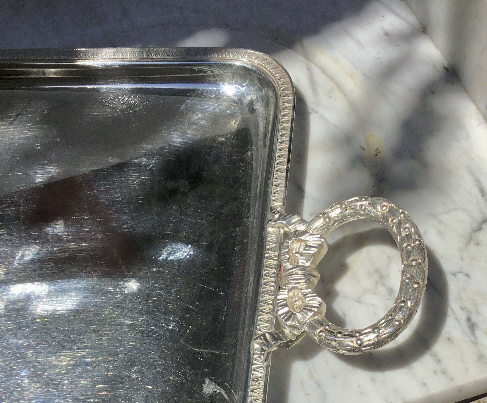 Silver-plated service tray in the Louis XVI style.