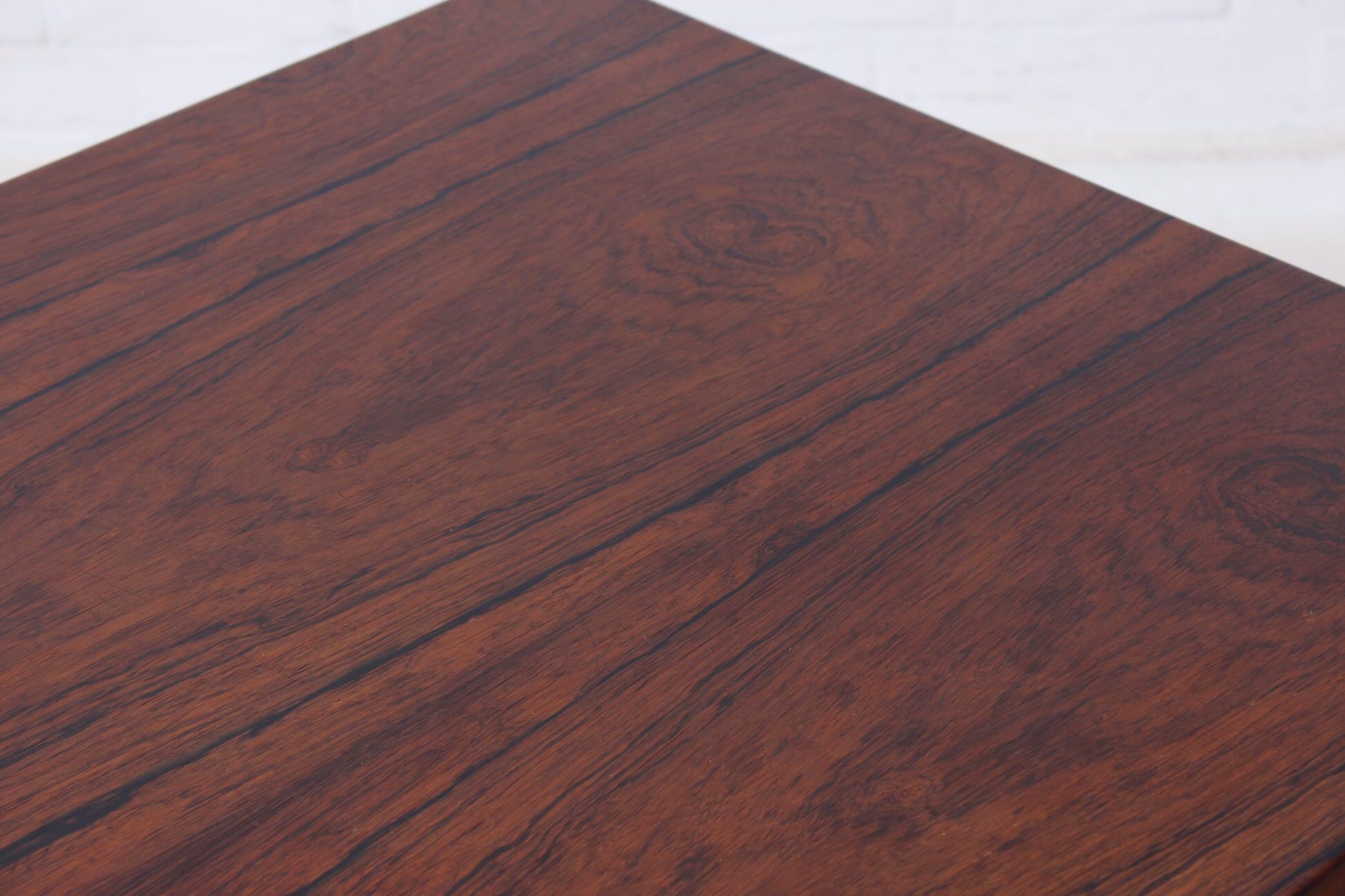 Minimalist rosewood desk by Riis Andersen