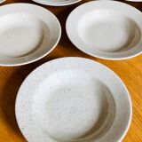 Set of 8 hollow plates in speckled ceramic