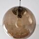 Smoked glass ball pendant light by Raak 1970