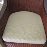 Vintage colonial-style armchair in woven rattan and exotic wood