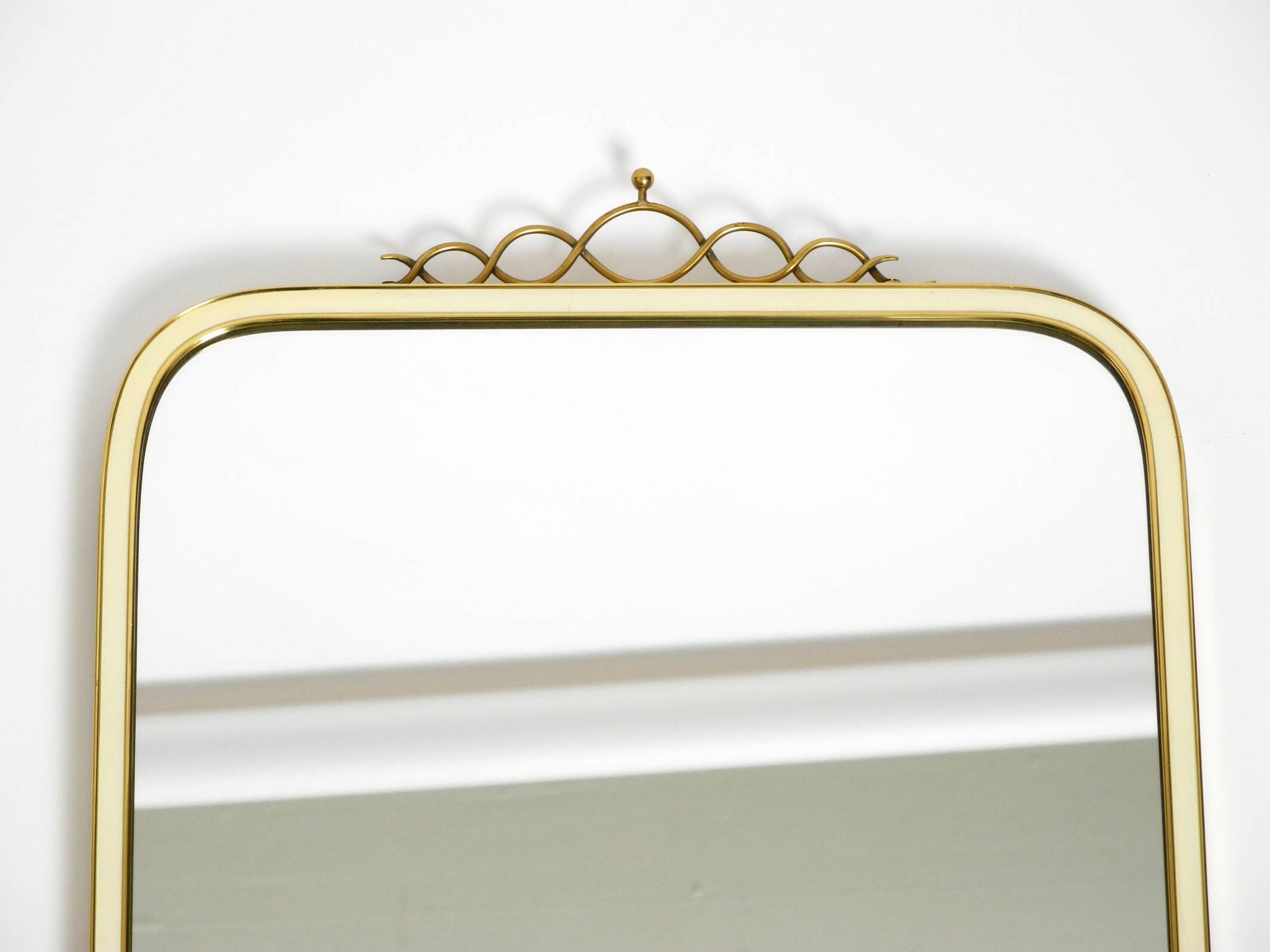 Large heavy long Mid Century brass wall mirror by Münchner Zierspiegel