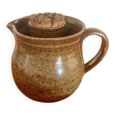 Large antique brown glazed stoneware jug with cork stopper.