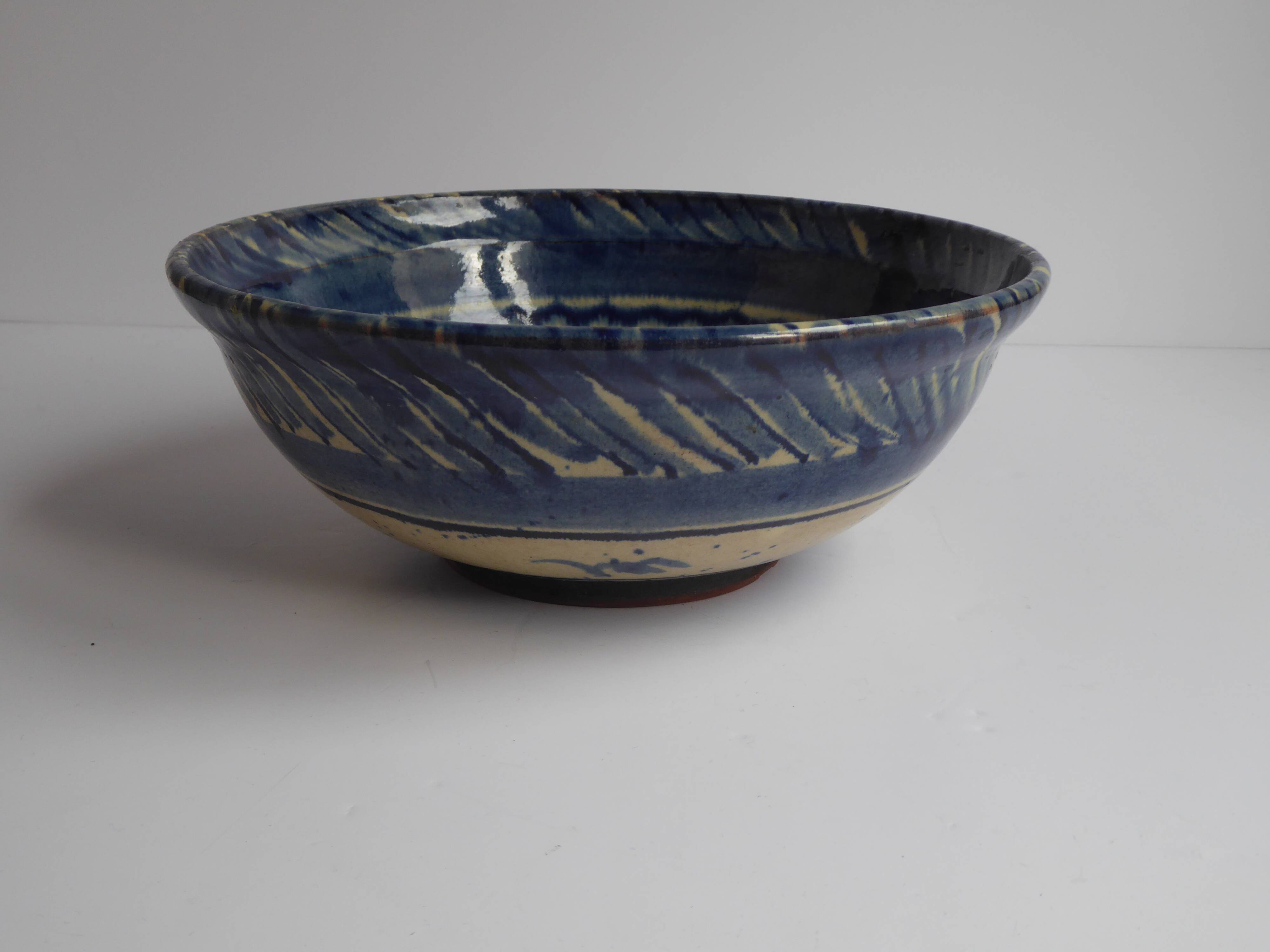 Blue enamelled terracotta cup