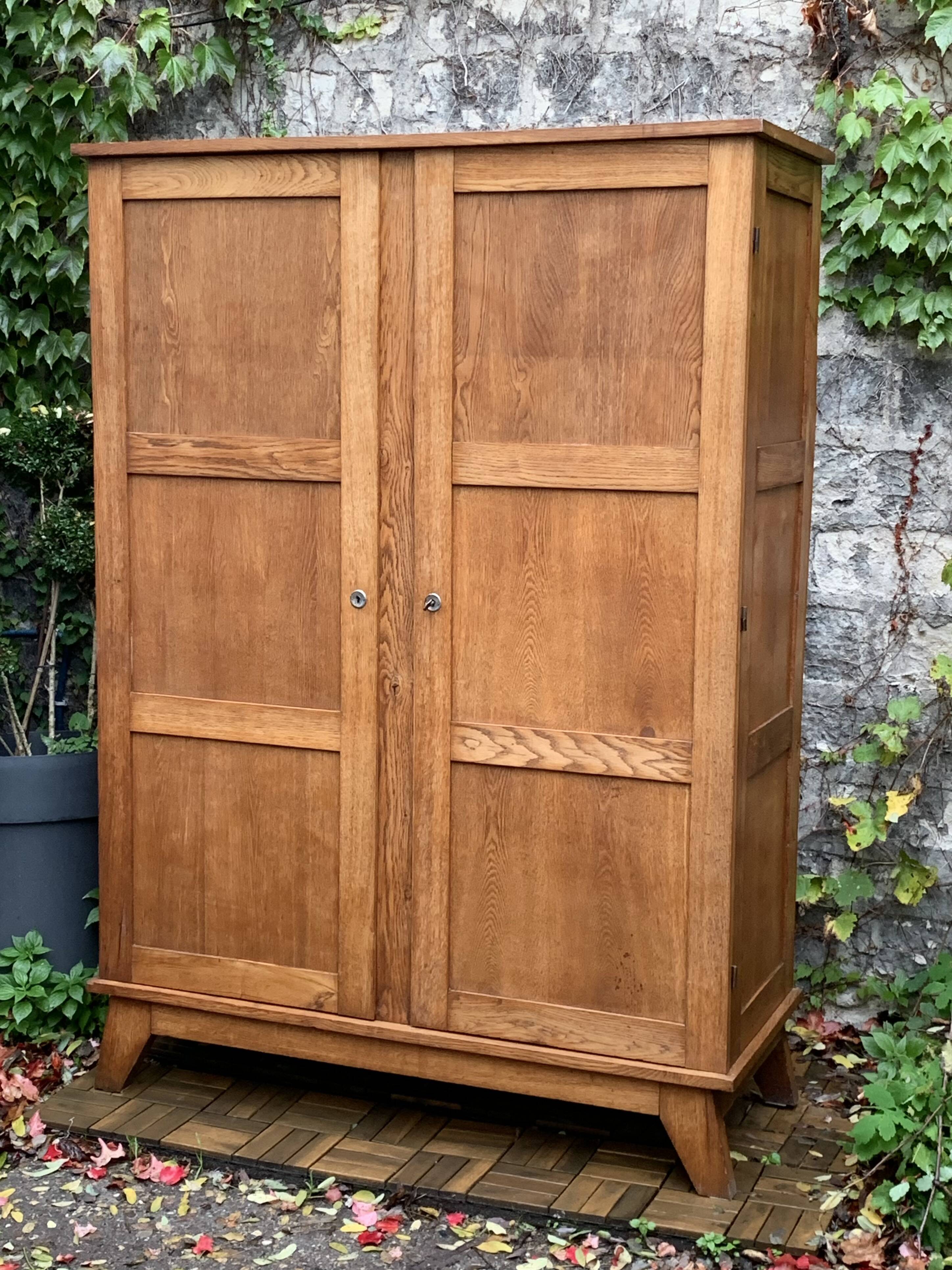 Solid oak compass foot cabinet René Gabriel 1945