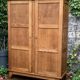 Solid oak compass foot cabinet René Gabriel 1945