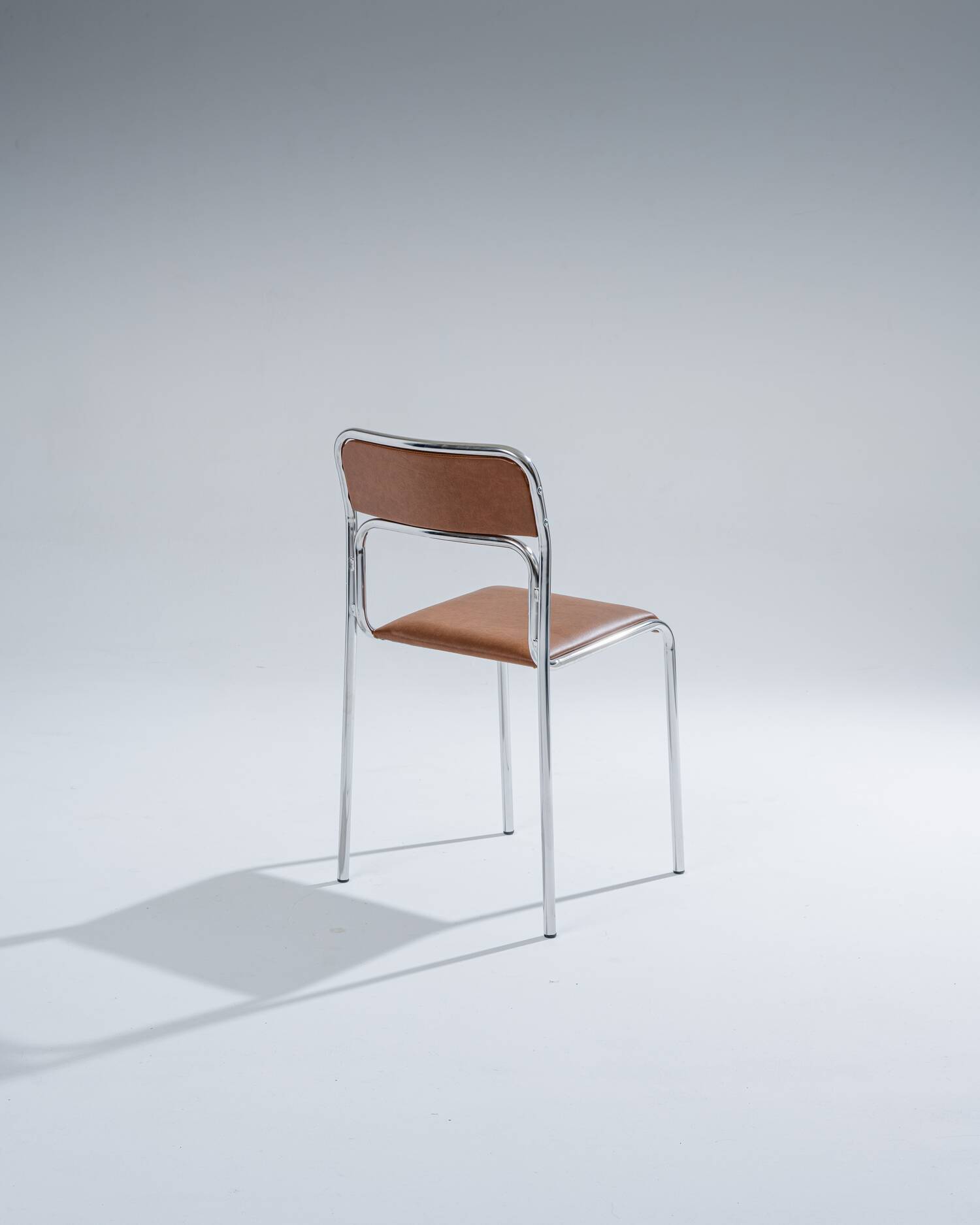Tubular steel and cognac leatherette chair, 1980s