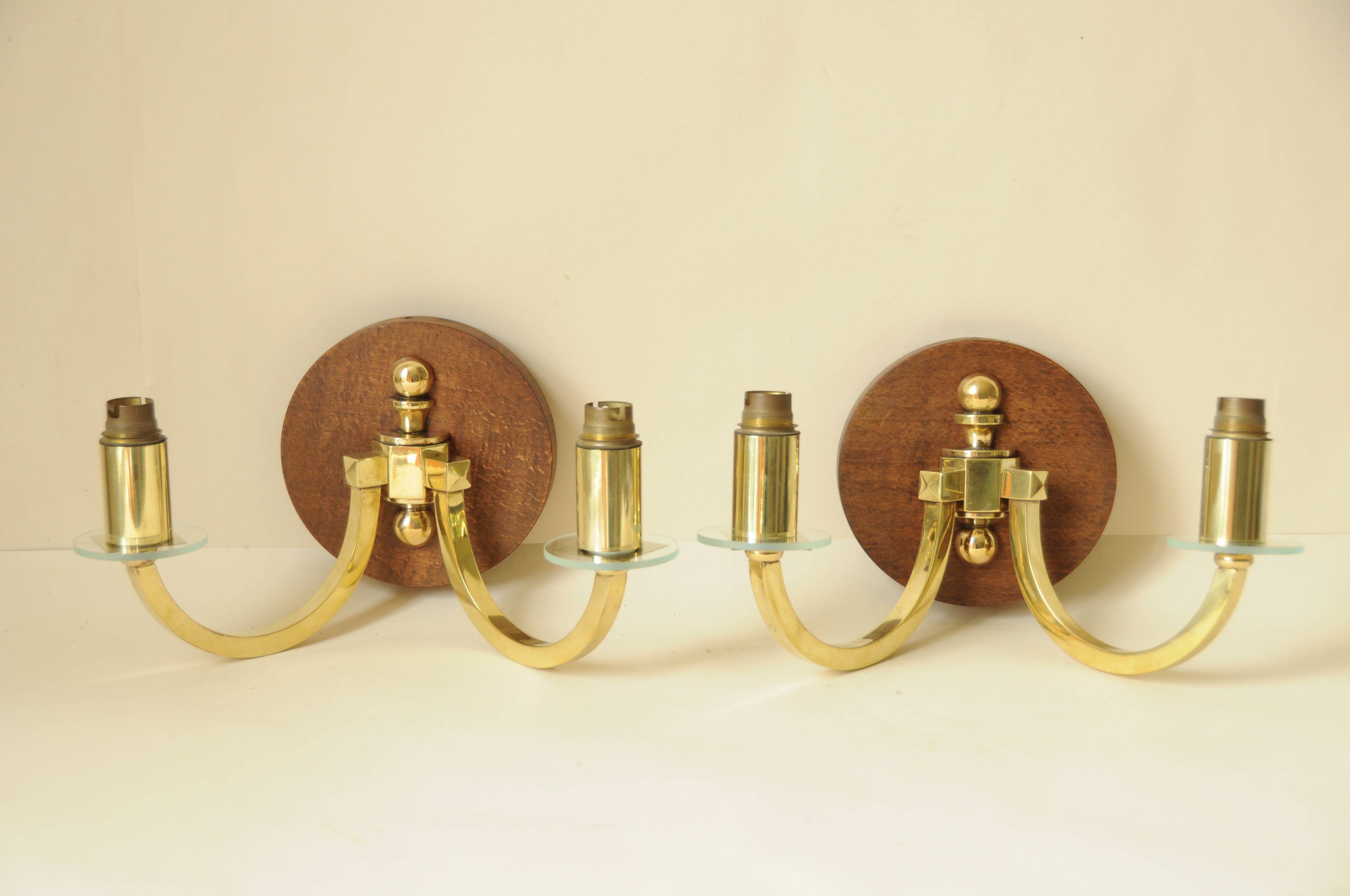Pair of vintage wall sconces in polished gold brass, wood and glass