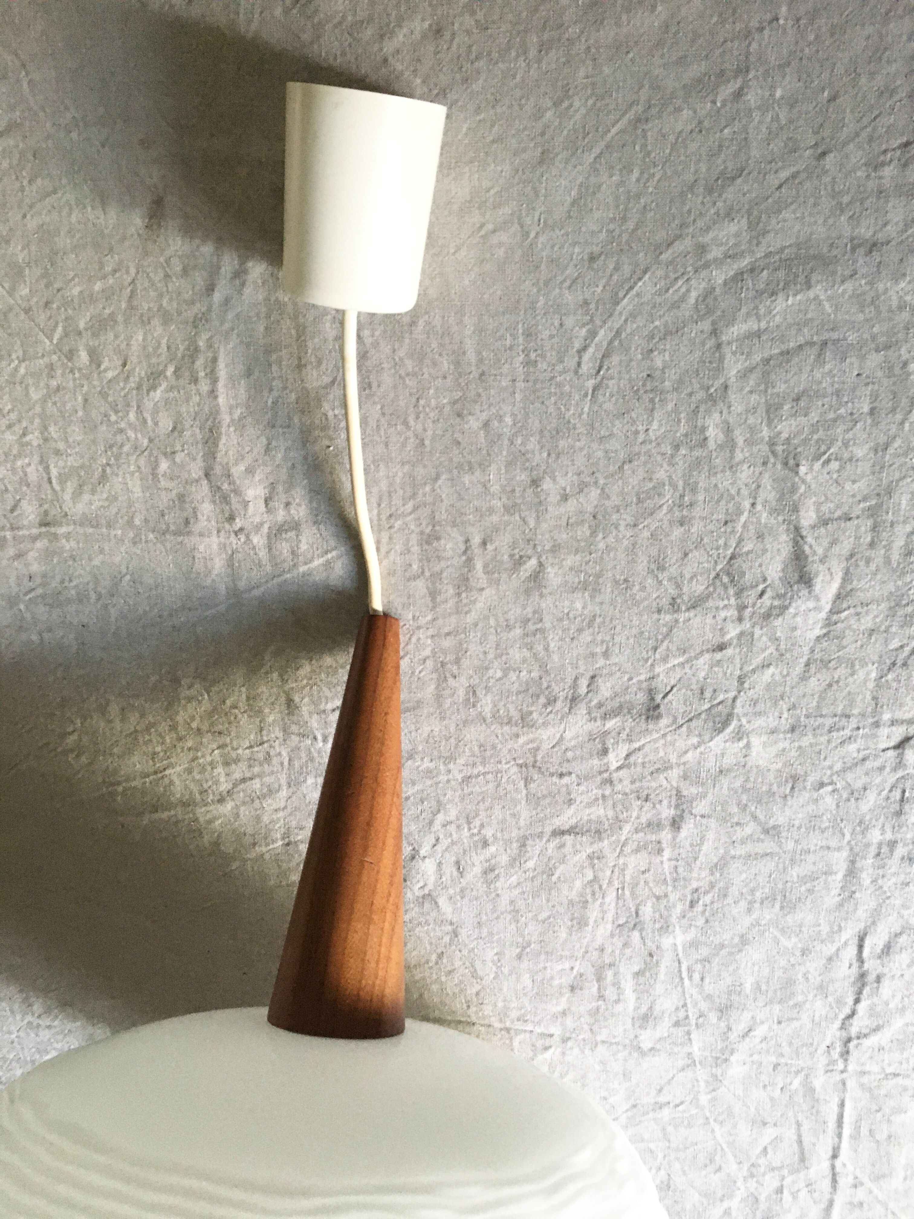 Suspension in opaline glass and teak by Louis Kalff for Philips