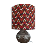Vintage table lamp with printed shade featuring seventies waves.
