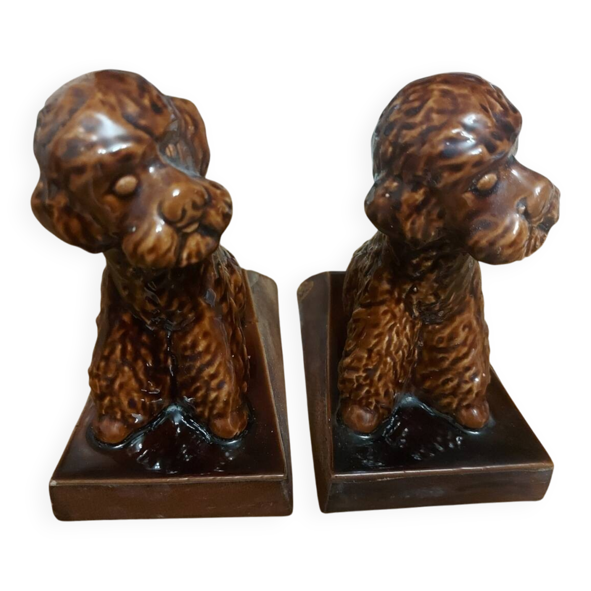Press book in the shape of a dog made of ceramic.
