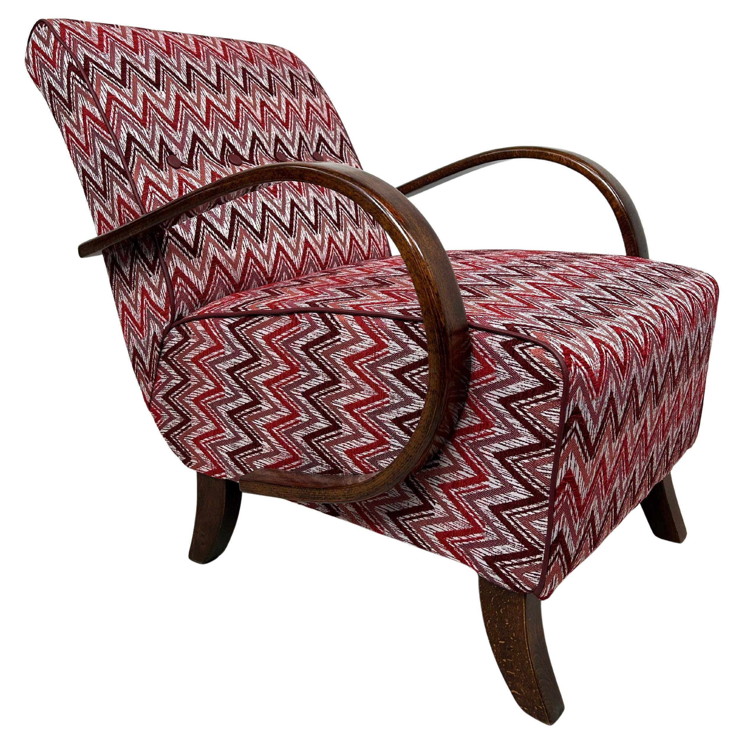 C-shaped lounge chair by J. Halabala