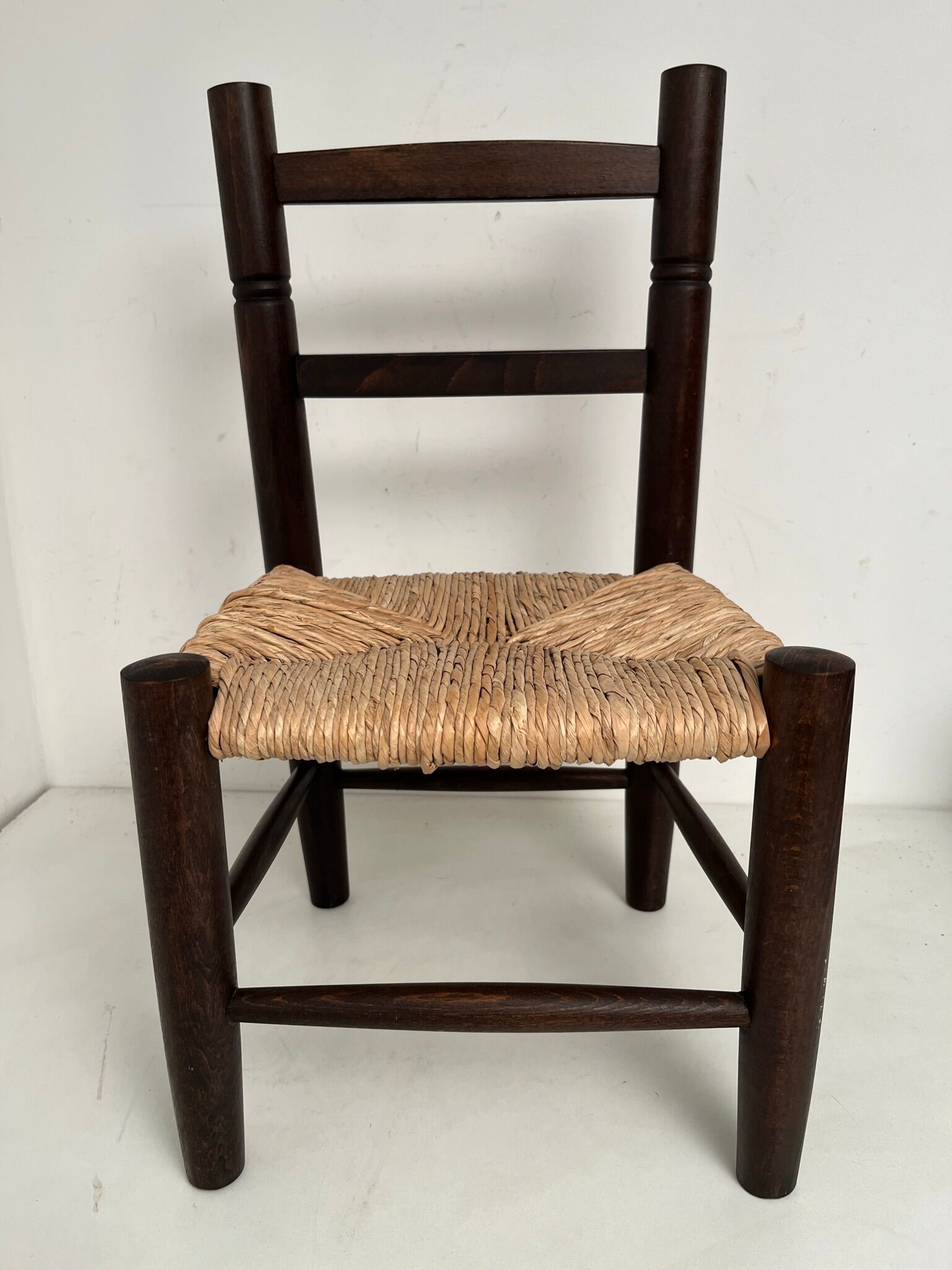 Wooden children's chair with vintage straw seat