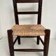 Wooden children's chair with vintage straw seat