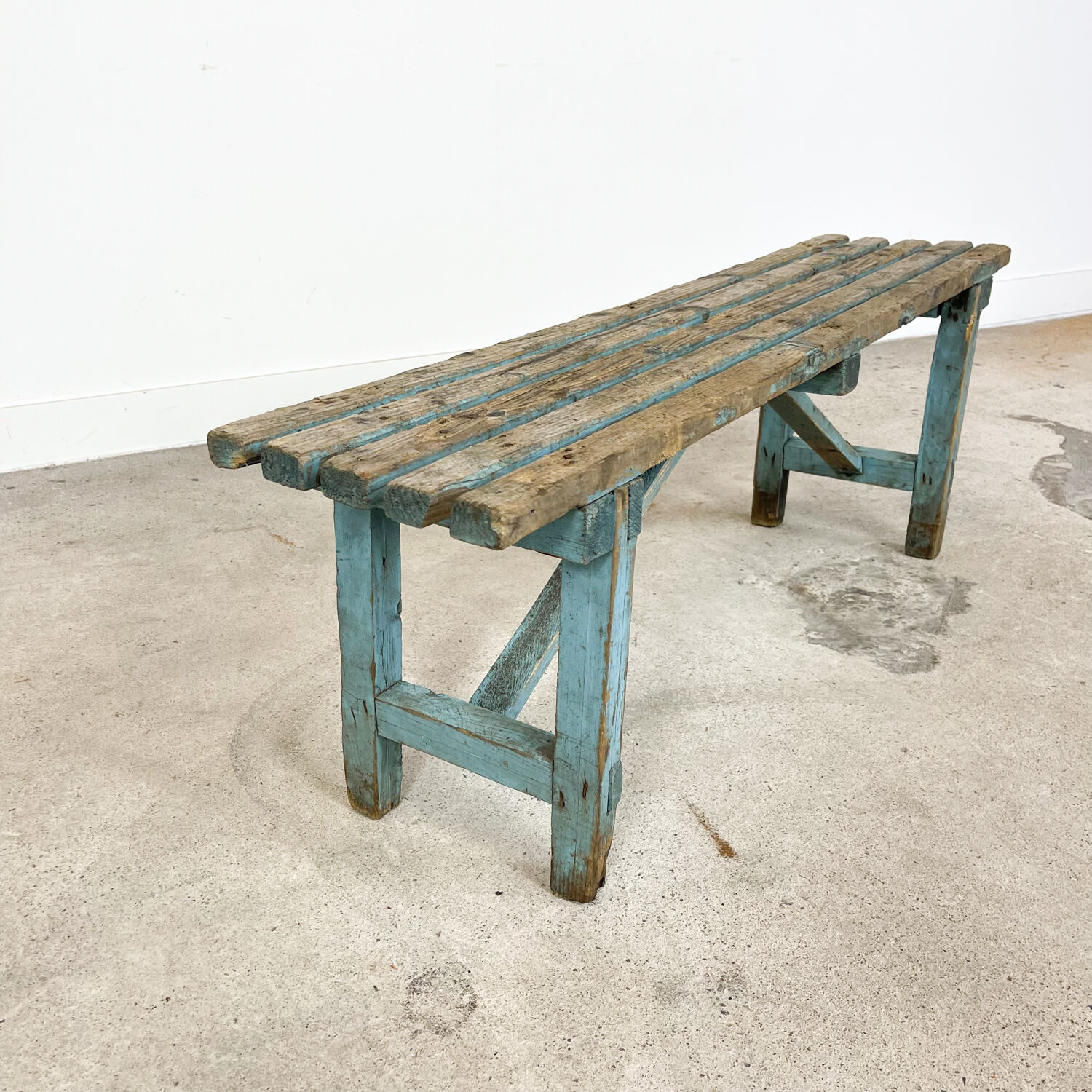 Light blue painted wooden farmhouse bench
