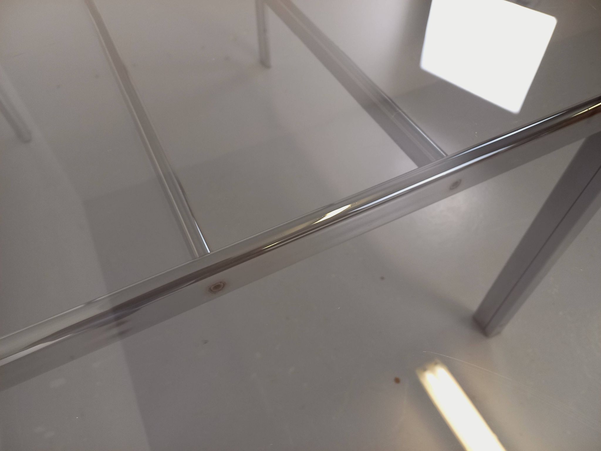 Vintage oval dining table in smoked glass and chrome metal, Space Age style.