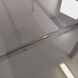 Vintage oval dining table in smoked glass and chrome metal, Space Age style.