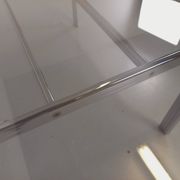 Vintage oval dining table in smoked glass and chrome metal, Space Age style.
