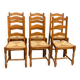 6 solid oak dining chairs with rush seats from the 1980s.