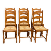 6 solid oak dining chairs with rush seats from the 1980s.