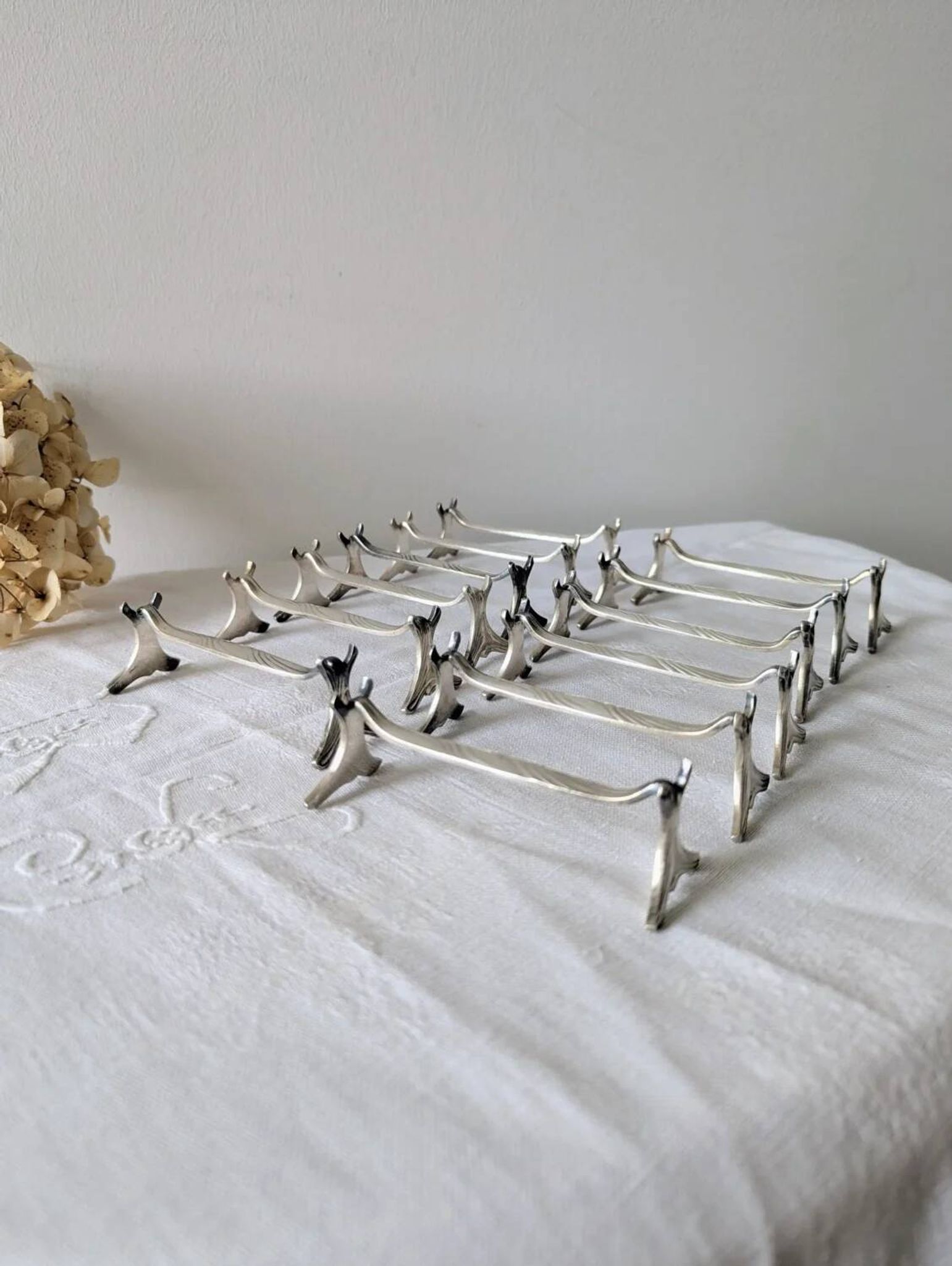 Set of 12 Christofle knife rests, Moderne 1912 model