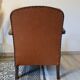 Paire de fauteuils studio simili cuir marron années 30