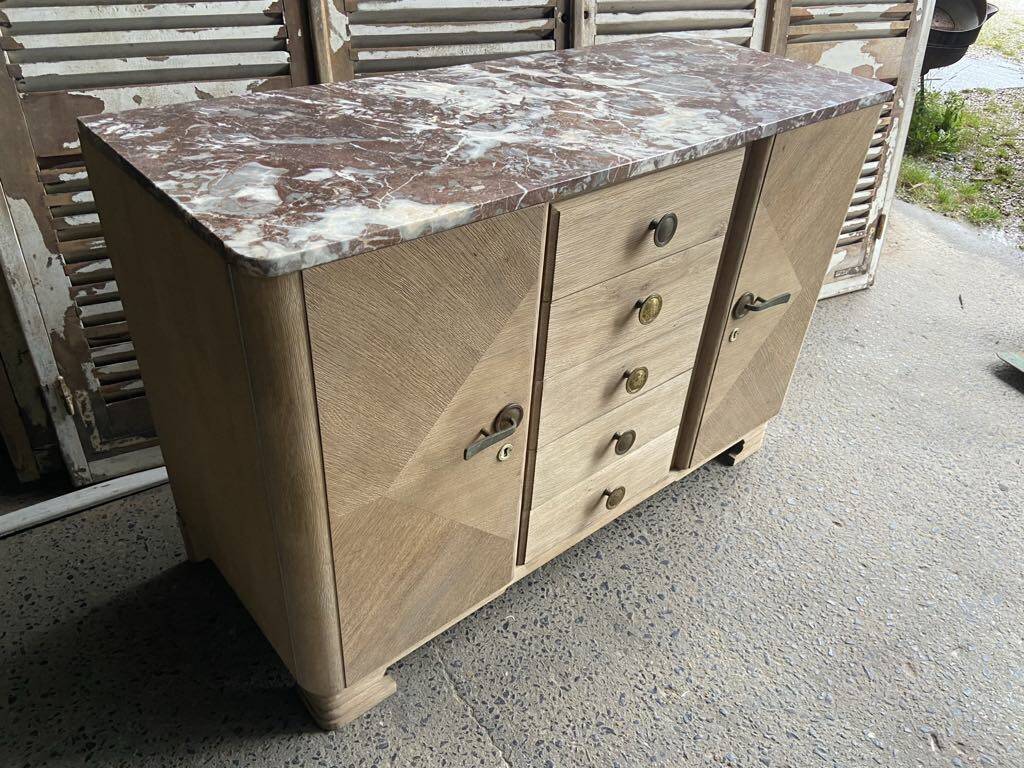 Raw wood chest of drawers with marble top