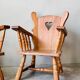 Pair of rustic oak armchairs – carved heart backrests