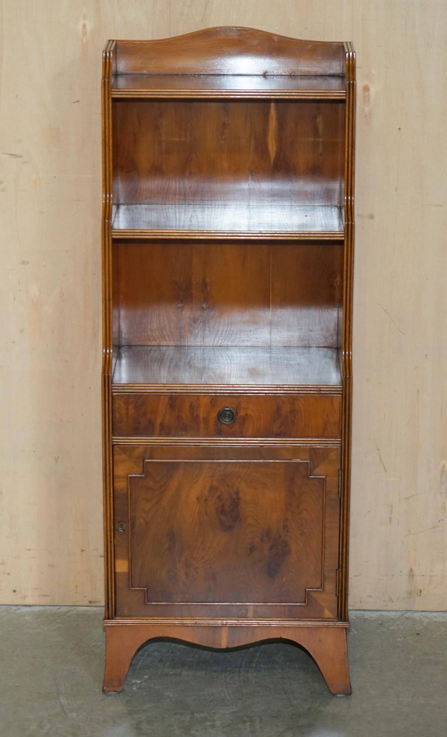 Pair of vintage English hardwood bookcases in a cascade style with cupboards.