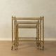 Set of 3 vintage Hollywood Regency nesting tables with brass frame and glass tops (1960s)