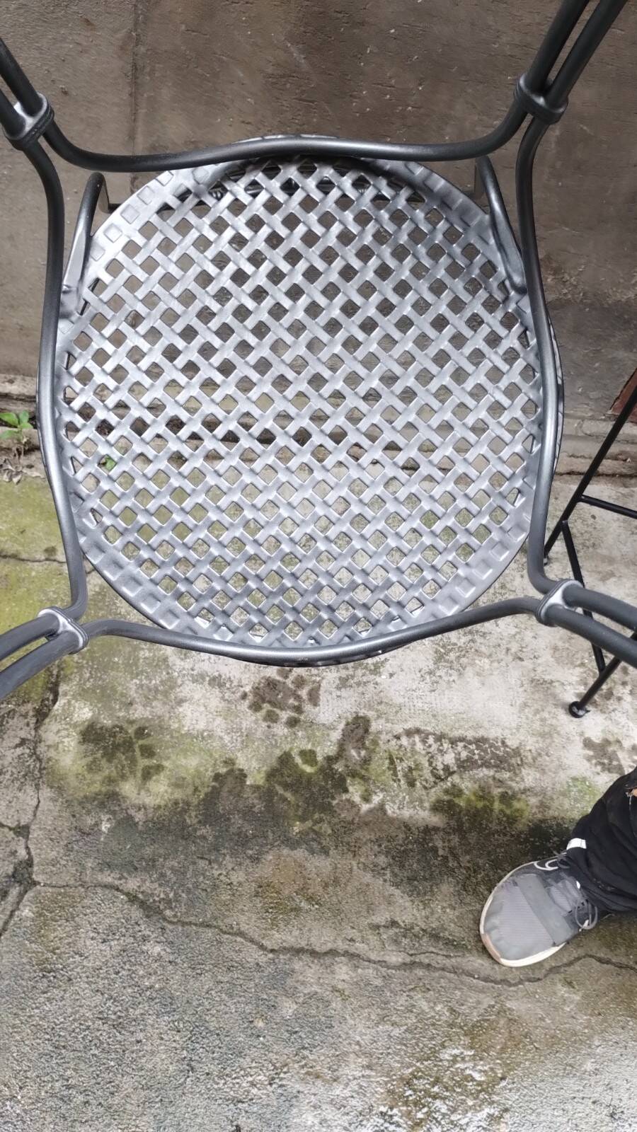 Dark gray wrought iron chair