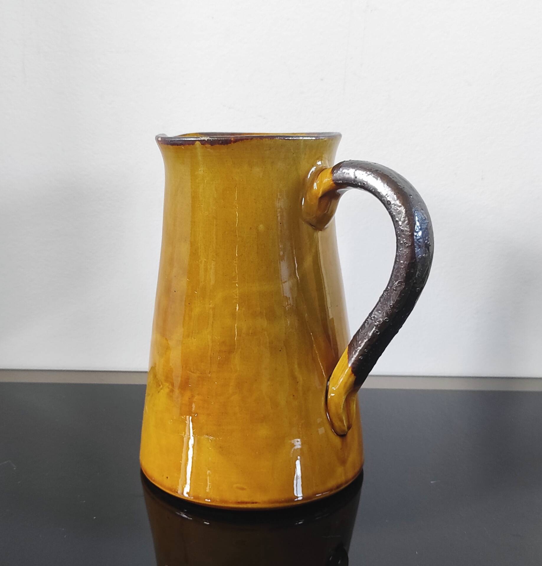 Vintage glazed terracotta pitcher