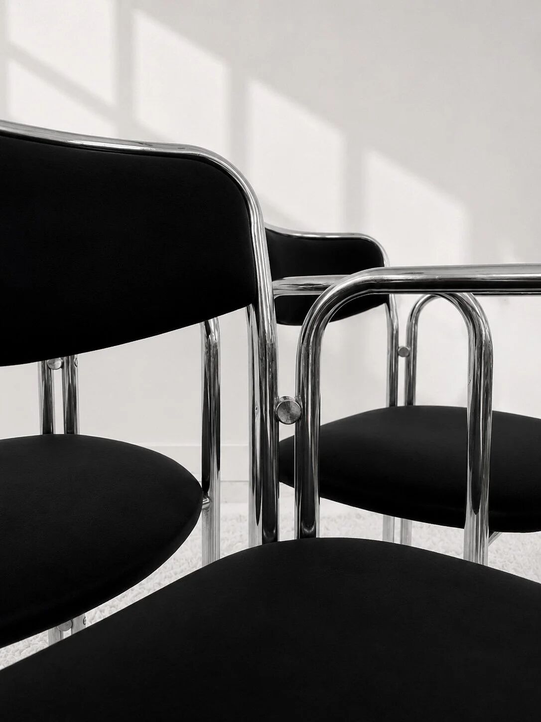 Vintage chairs with double chrome structure and black velvet. 70s