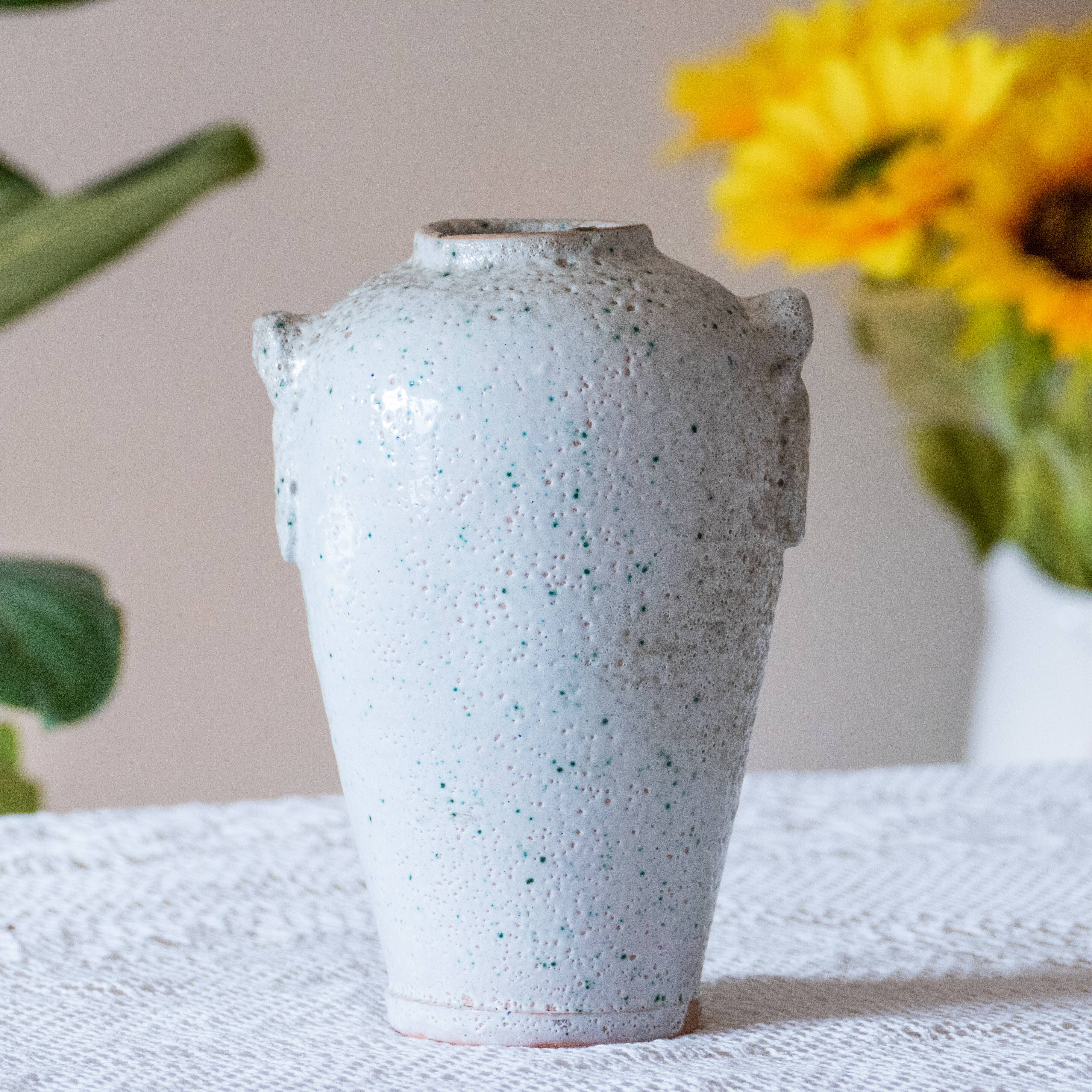 Old foam-glazed terracotta vase